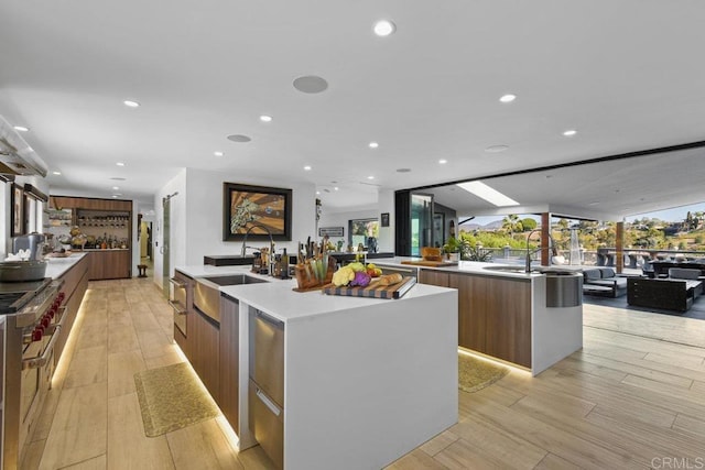 5455 Toyon Rd, San Diego, CA 92115 - kitchen featuring a spacious island, modern cabinets, a sink, and recessed lighting
