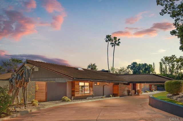 5455 Toyon Rd, San Diego, CA 92115 - ranch-style home featuring a tiled roof, curved driveway, and stucco siding