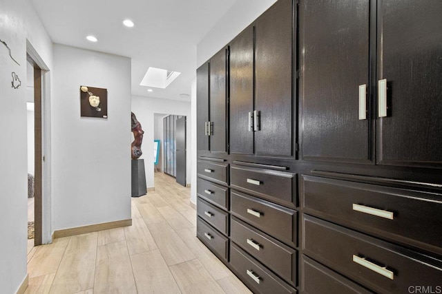 5455 Toyon Rd, San Diego, CA 92115 - corridor featuring a skylight, recessed lighting, and light wood-style flooring