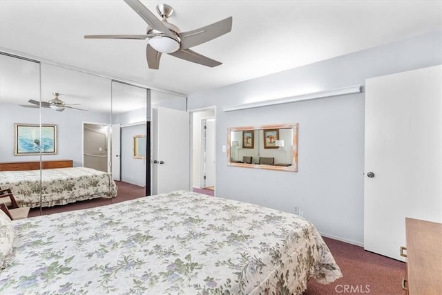 bedroom with ceiling fan, a closet, and dark colored carpet