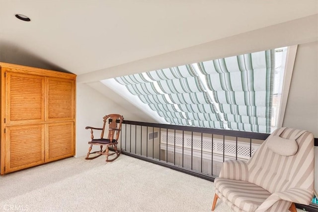 living area with lofted ceiling and carpet floors