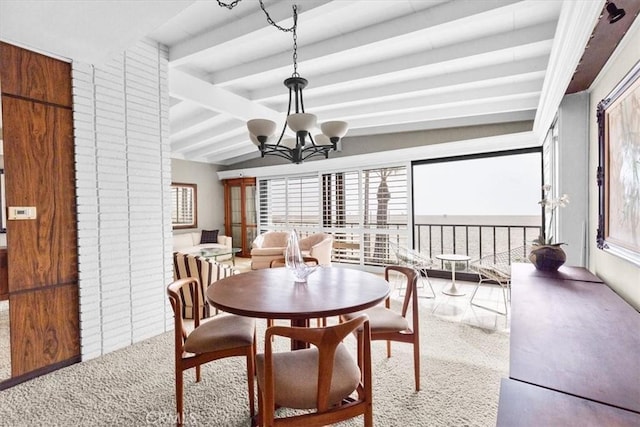 dining area featuring carpet, beamed ceiling, and a chandelier