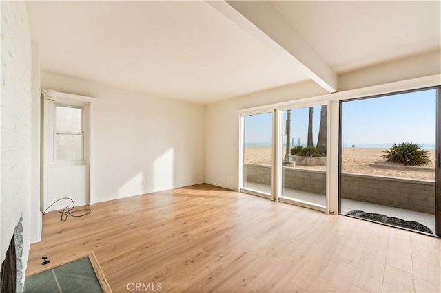 1510 W Oceanfront, Newport Beach, CA 92663 - unfurnished room with wood finished floors and beam ceiling