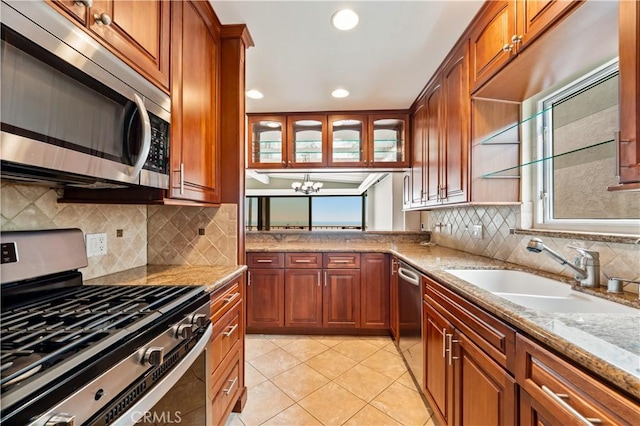1510 W Oceanfront, Newport Beach, CA 92663 - kitchen with stainless steel appliances, healthy amount of natural light, a sink, recessed lighting, and light stone countertops