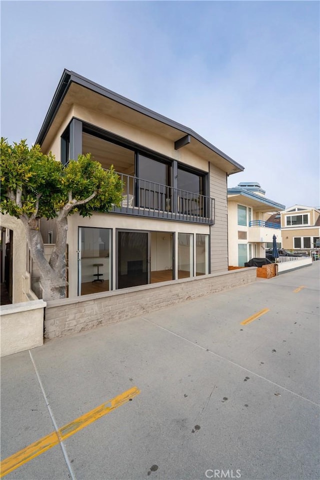 1510 W Oceanfront, Newport Beach, CA 92663 - rear view of property featuring a balcony