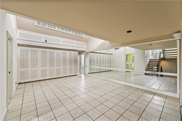 1510 W Oceanfront, Newport Beach, CA 92663 - empty room featuring tile patterned floors, baseboards, and stairway