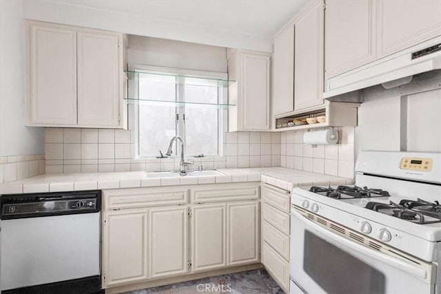 1510 W Oceanfront, Newport Beach, CA 92663 - kitchen featuring white appliances, tile countertops, under cabinet range hood, and decorative backsplash