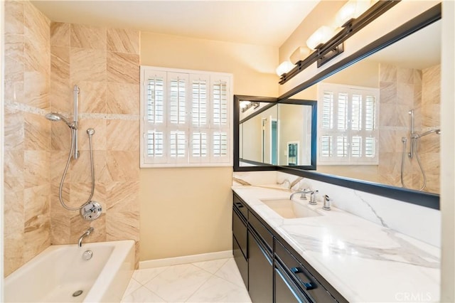 bathroom with marble finish floor, bathing tub / shower combination, vanity, and baseboards