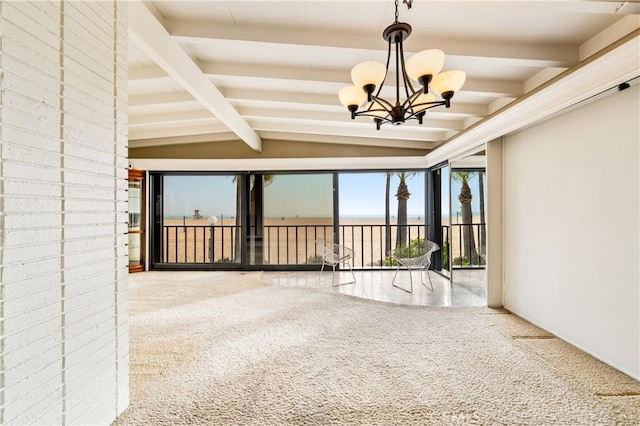 unfurnished sunroom with vaulted ceiling with beams and a chandelier