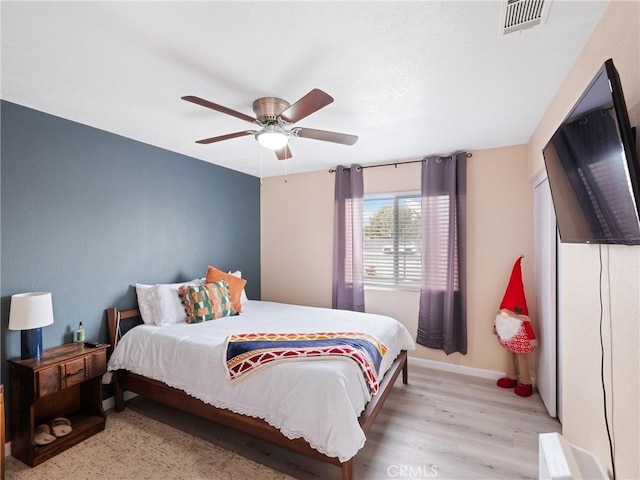 bedroom featuring ceiling fan and light hardwood / wood-style floors