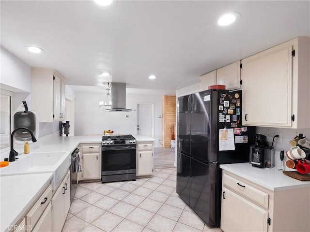 kitchen with black appliances, exhaust hood, tasteful backsplash, sink, and light tile patterned flooring