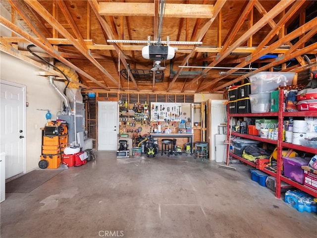 garage featuring a workshop area and a garage door opener