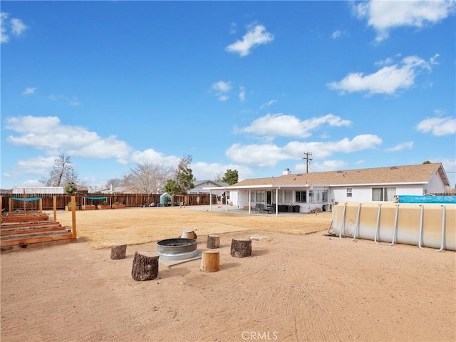 view of yard featuring a fire pit