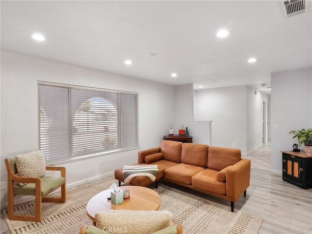 living room with light hardwood / wood-style flooring