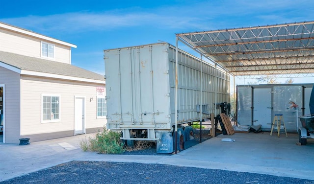 view of outdoor structure with a carport