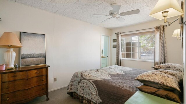 bedroom featuring ceiling fan, carpet, and ensuite bath