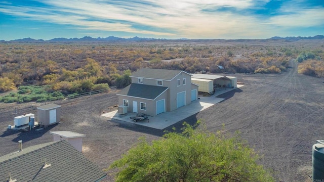 birds eye view of property with a mountain view