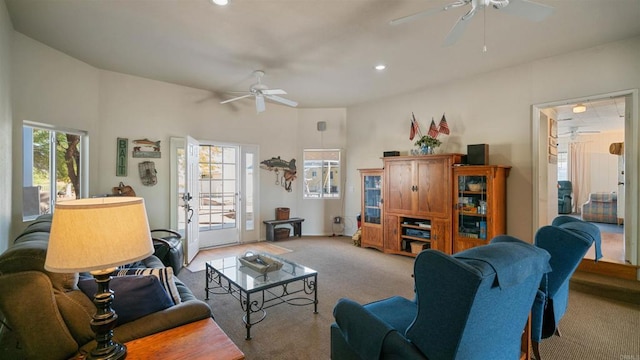 carpeted living room featuring ceiling fan