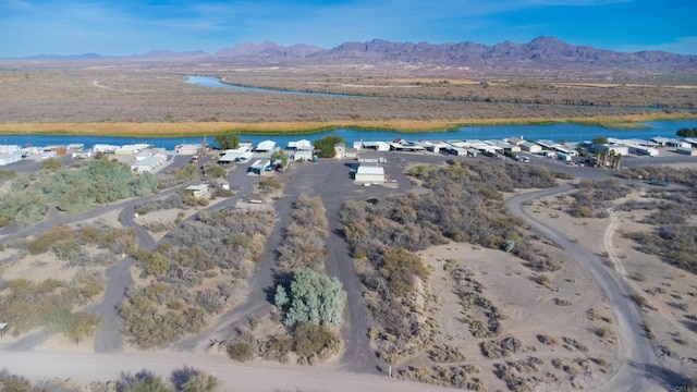 bird's eye view with a water and mountain view