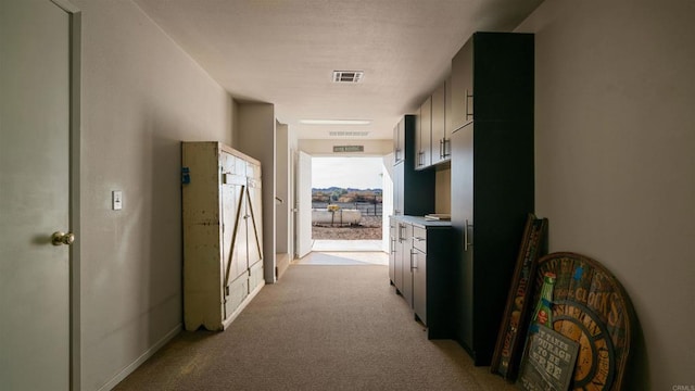 corridor featuring light carpet