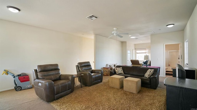 living room with ceiling fan and light colored carpet