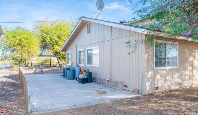 view of home's exterior with central AC and a patio