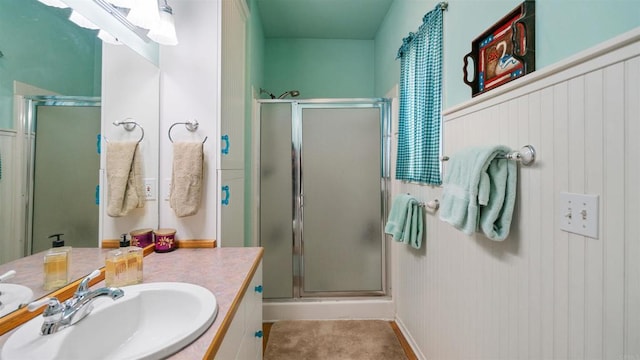 bathroom featuring an enclosed shower and vanity