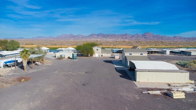 2564 Walters Camp Rd, Winterhaven, CA 92283 - view of asphalt road with a mountain view, an outbuilding, and a residential view