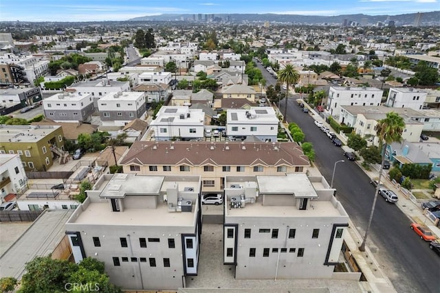 birds eye view of property featuring a mountain view