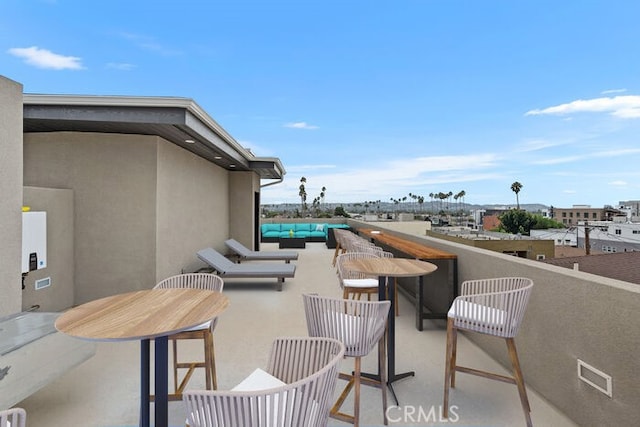 view of patio with a balcony and outdoor lounge area