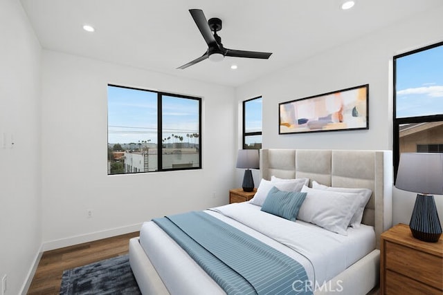 bedroom featuring ceiling fan and dark wood-type flooring