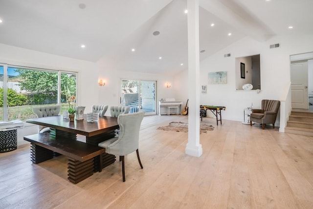 dining area featuring visible vents, light wood finished floors, high vaulted ceiling, beam ceiling, and recessed lighting