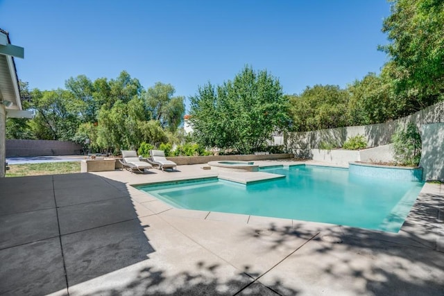 view of swimming pool with an in ground hot tub and a patio