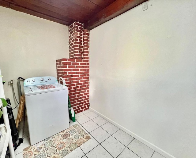 laundry room featuring light tile patterned flooring, washer / clothes dryer, and wooden ceiling