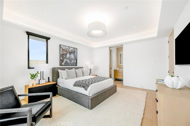 433 Harbor Island Dr, Newport Beach, CA 92660 - bedroom featuring a tray ceiling and wood finished floors