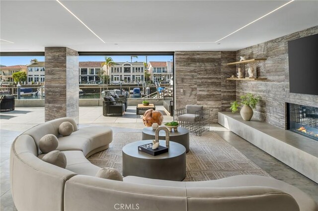433 Harbor Island Dr, Newport Beach, CA 92660 - living room featuring a fireplace and floor to ceiling windows