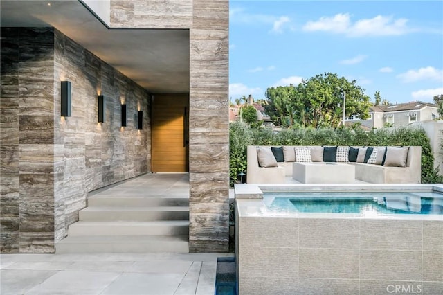 view of swimming pool featuring an outdoor living space