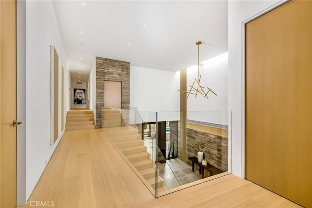 433 Harbor Island Dr, Newport Beach, CA 92660 - hallway featuring an upstairs landing and wood finished floors