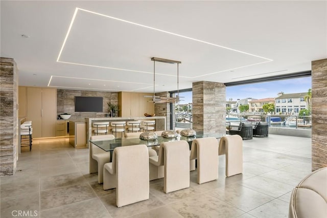 433 Harbor Island Dr, Newport Beach, CA 92660 - dining space featuring a wall of windows and tile patterned flooring