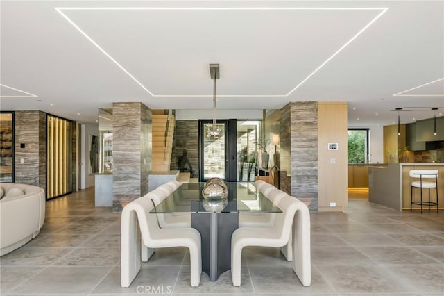 433 Harbor Island Dr, Newport Beach, CA 92660 - dining area featuring decorative columns and light tile patterned floors