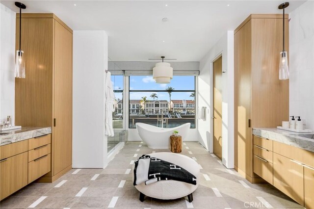 433 Harbor Island Dr, Newport Beach, CA 92660 - full bathroom featuring a freestanding tub, vanity, and a shower stall