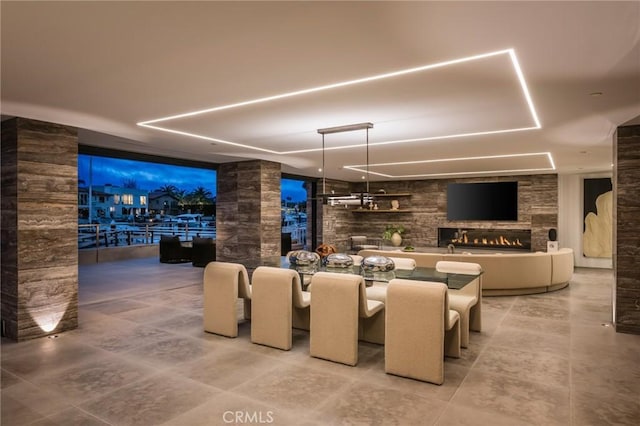 433 Harbor Island Dr, Newport Beach, CA 92660 - tiled dining area with a stone fireplace