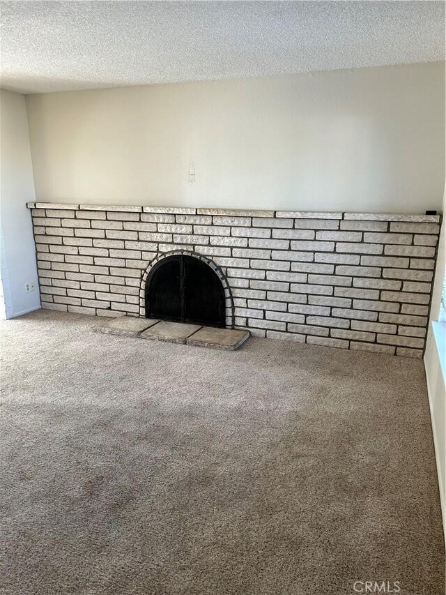 room details featuring carpet flooring and a textured ceiling