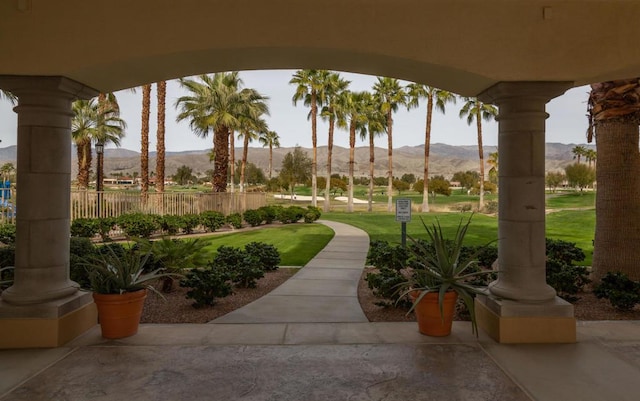 view of property's community featuring a mountain view and a lawn