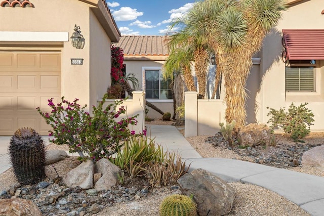 doorway to property featuring a garage