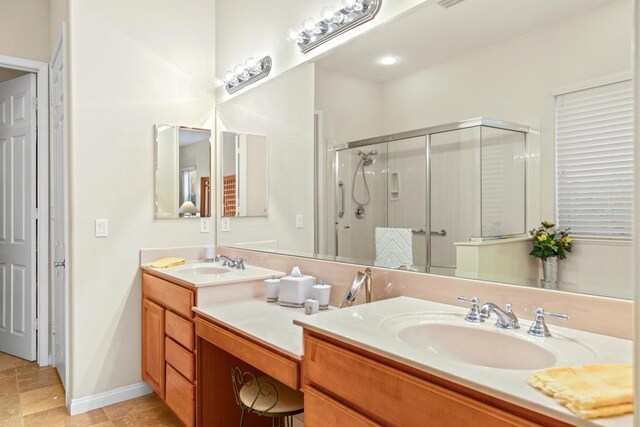 bathroom with vanity and an enclosed shower