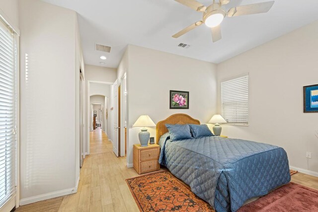 bedroom featuring ceiling fan and light hardwood / wood-style flooring