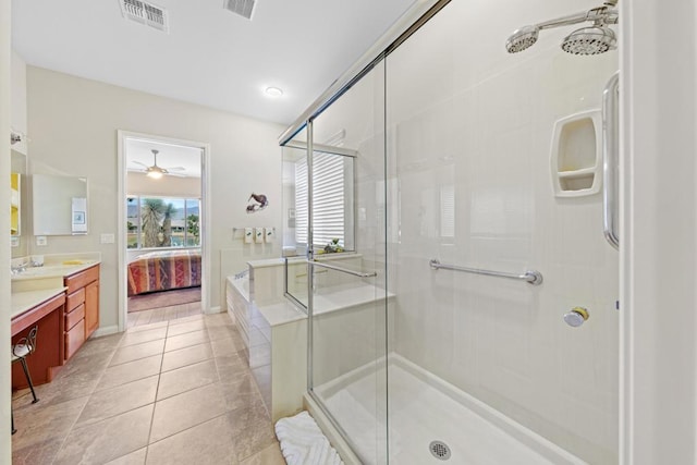 bathroom with ceiling fan, shower with separate bathtub, vanity, and tile patterned flooring