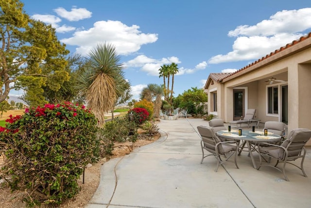 view of patio featuring ceiling fan