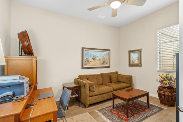 interior space with ceiling fan and light hardwood / wood-style floors